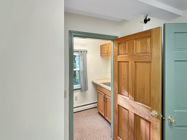 bathroom with a baseboard heating unit and vanity
