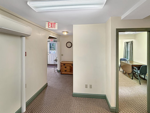 hall with carpet and baseboards