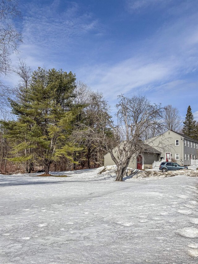 view of yard layered in snow