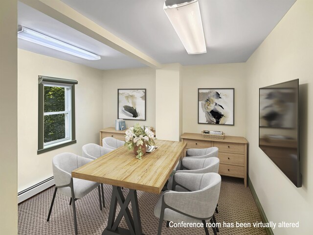 carpeted dining room featuring a baseboard heating unit and baseboards