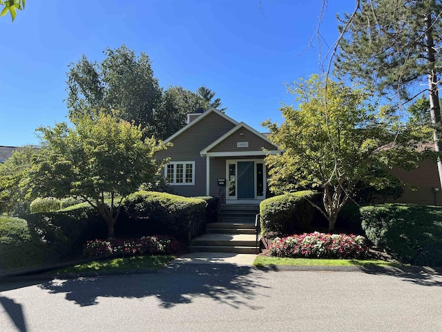 view of front of home with a chimney