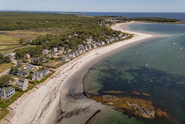 bird's eye view with a water view and a beach view