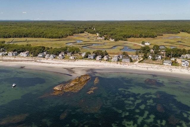 drone / aerial view with a water view and a view of the beach