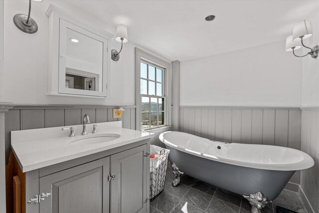 882 Mitchell Rd, Shrewsbury, VT 05738 - full bathroom featuring vanity, a freestanding bath, and wainscoting