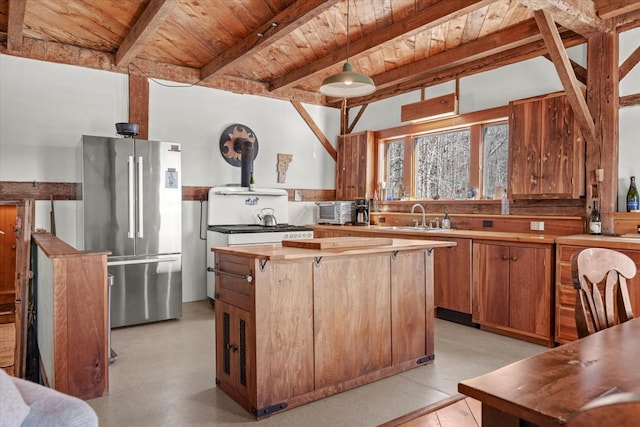 882 Mitchell Rd, Shrewsbury, VT 05738 - kitchen with beam ceiling, freestanding refrigerator, a sink, wooden ceiling, and a center island