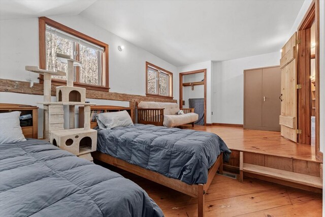 882 Mitchell Rd, Shrewsbury, VT 05738 - bedroom featuring light wood-type flooring and vaulted ceiling