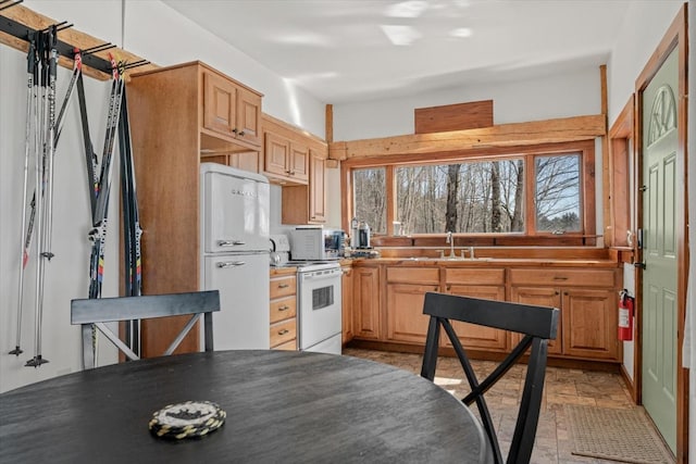 882 Mitchell Rd, Shrewsbury, VT 05738 - kitchen featuring stone finish floor, white appliances, and a sink