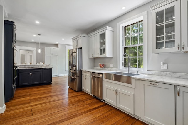 51 E Derry Rd, Derry, NH 03038 - kitchen featuring a sink, pendant lighting, recessed lighting, appliances with stainless steel finishes, and wood-type flooring