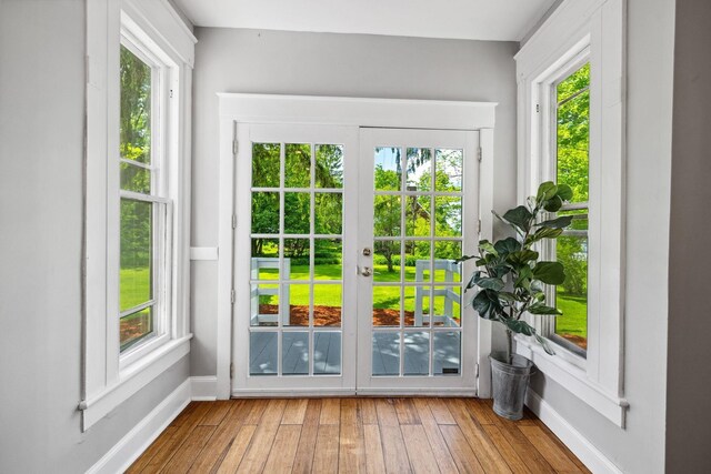 51 E Derry Rd, Derry, NH 03038 - doorway featuring a healthy amount of sunlight, french doors, baseboards, and wood-type flooring