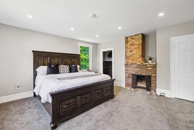 51 E Derry Rd, Derry, NH 03038 - bedroom with recessed lighting, a fireplace, baseboards, and light carpet