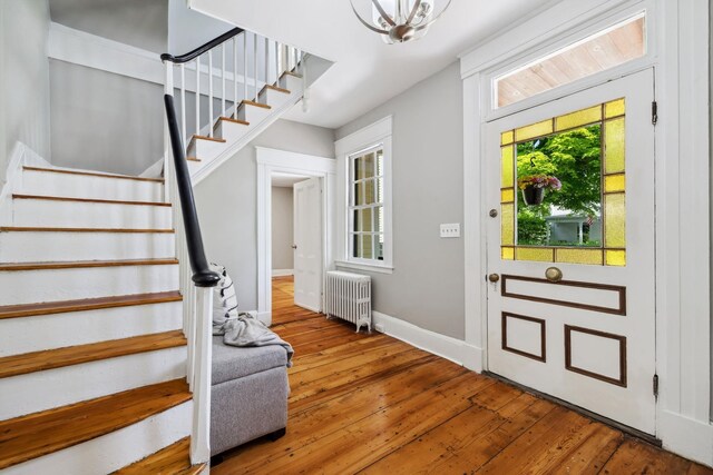51 E Derry Rd, Derry, NH 03038 - entrance foyer featuring stairway, radiator, baseboards, and wood-type flooring