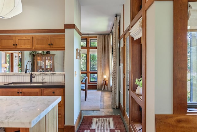 kitchen with brown cabinets and a sink