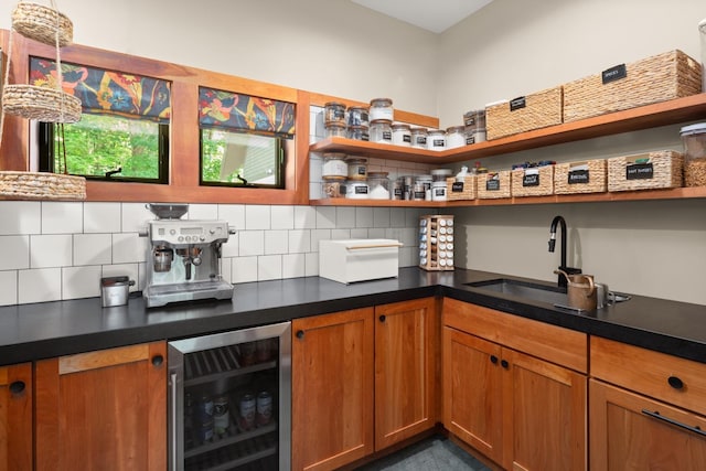 bar featuring wine cooler, decorative backsplash, indoor bar, and a sink