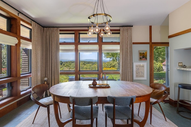 dining room featuring a chandelier