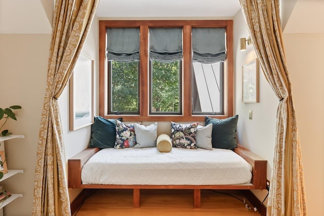 bedroom with wood finished floors