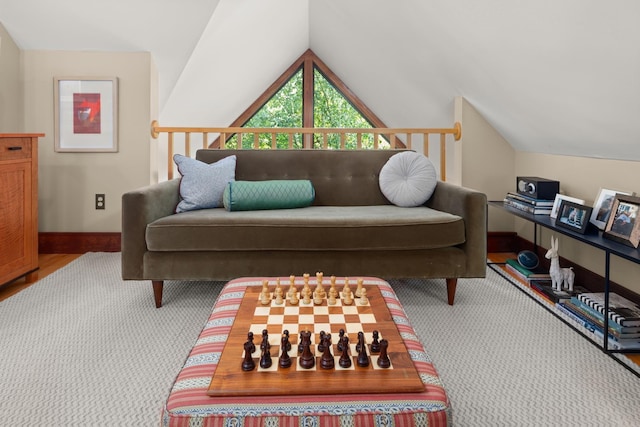 interior space with baseboards and lofted ceiling