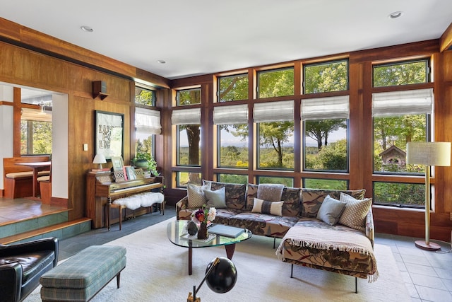 sunroom featuring tile patterned flooring and plenty of natural light
