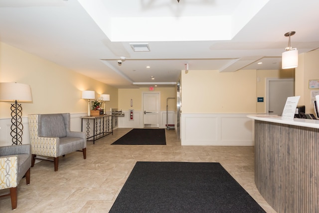 reception area with visible vents and a bar