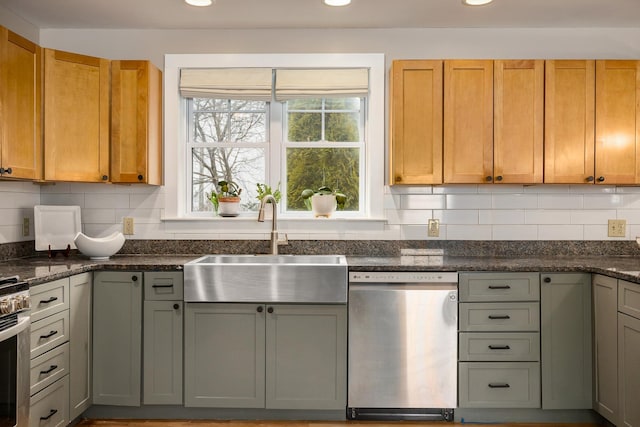 kitchen featuring a sink, stainless steel dishwasher, tasteful backsplash, and recessed lighting