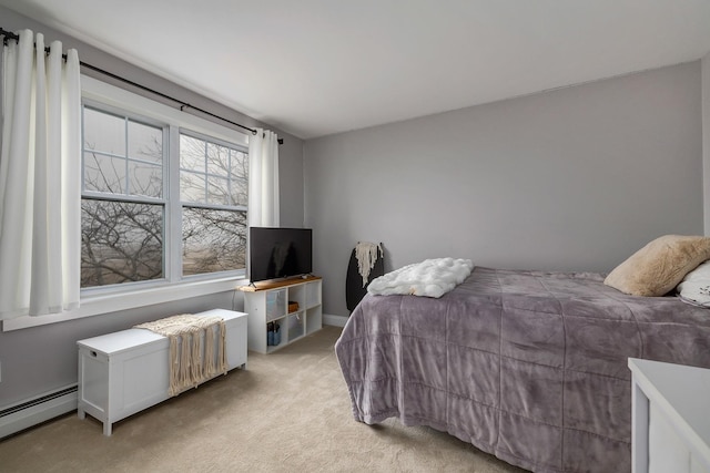 bedroom featuring baseboard heating and light colored carpet