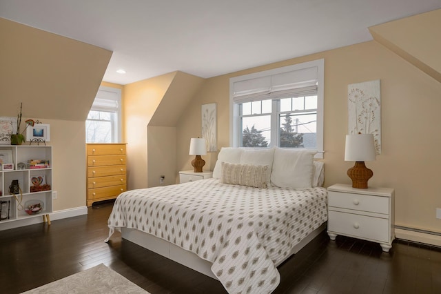 bedroom featuring a baseboard radiator, baseboards, dark wood finished floors, and recessed lighting