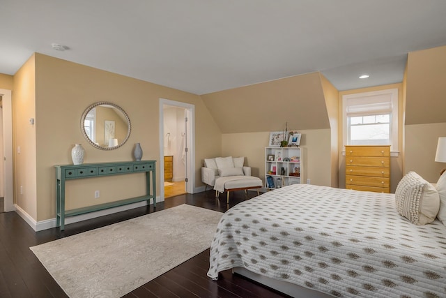 bedroom with connected bathroom, dark wood-type flooring, vaulted ceiling, recessed lighting, and baseboards
