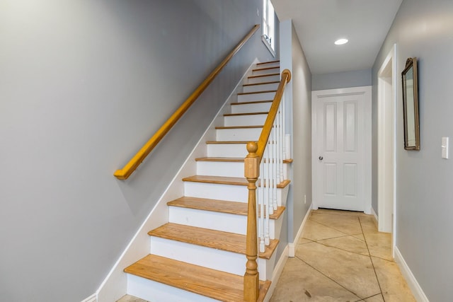stairway featuring recessed lighting, tile patterned floors, and baseboards