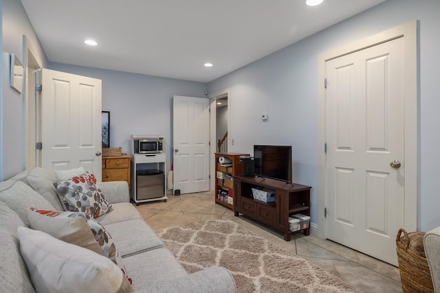 living area with stairway and recessed lighting