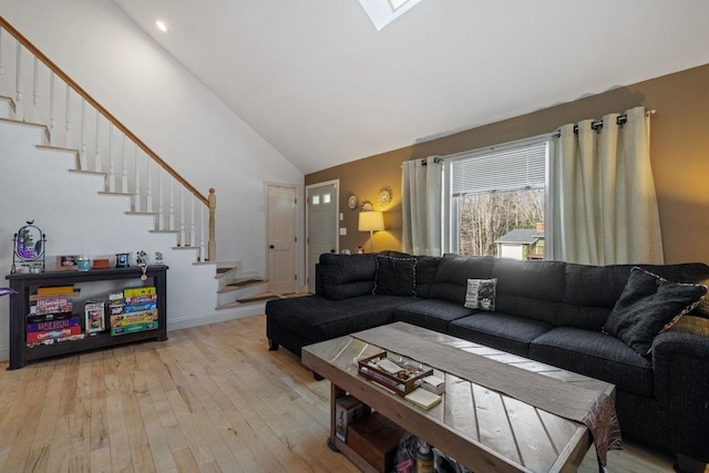 9 Sands Ter, Barnstead, NH 03225 - living room featuring stairway, light wood-type flooring, high vaulted ceiling, and baseboards