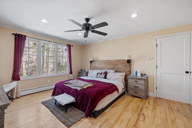 9 Sands Ter, Barnstead, NH 03225 - bedroom with baseboard heating, wood finished floors, ornamental molding, recessed lighting, and baseboards