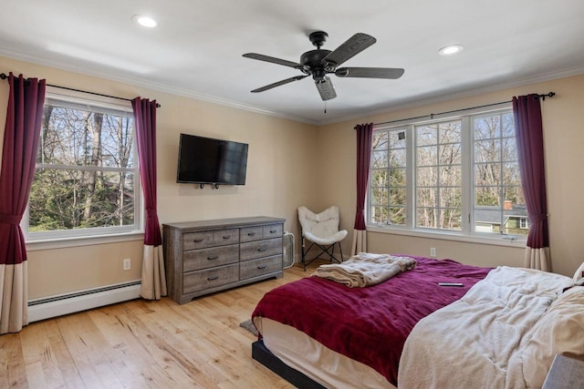 9 Sands Ter, Barnstead, NH 03225 - bedroom featuring a baseboard heating unit, multiple windows, light wood finished floors, ornamental molding, and a ceiling fan