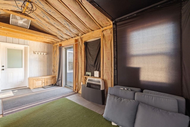 9 Sands Ter, Barnstead, NH 03225 - unfurnished living room featuring carpet flooring, vaulted ceiling, and wood walls