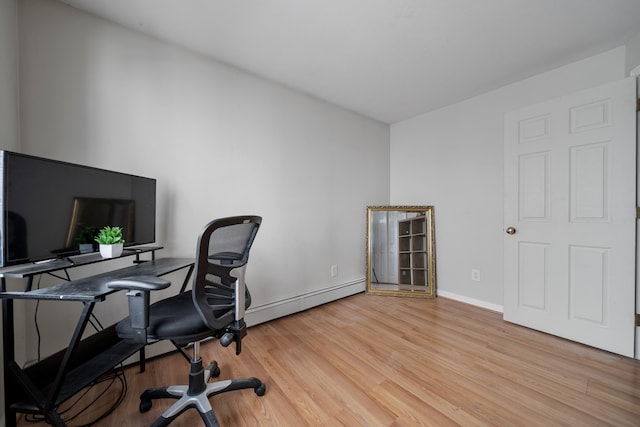 office with light wood-type flooring, baseboards, and baseboard heating