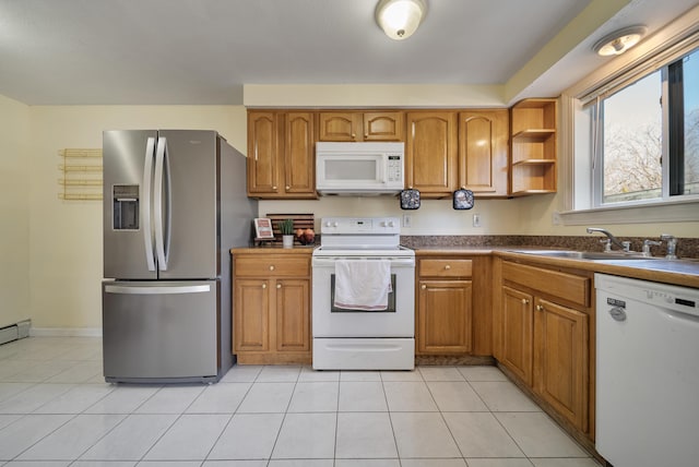 kitchen featuring white appliances, brown cabinetry, light tile patterned flooring, a sink, and dark countertops