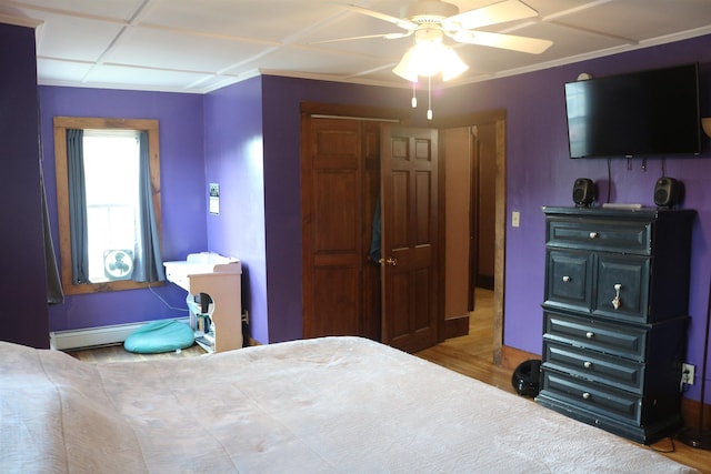 63 Province St, Richford, VT 05476 - bedroom featuring ceiling fan, baseboard heating, and wood finished floors