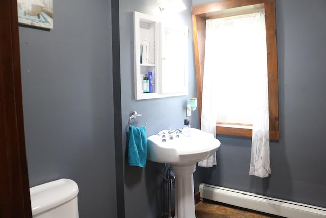 63 Province St, Richford, VT 05476 - bathroom featuring a sink, toilet, and a baseboard radiator