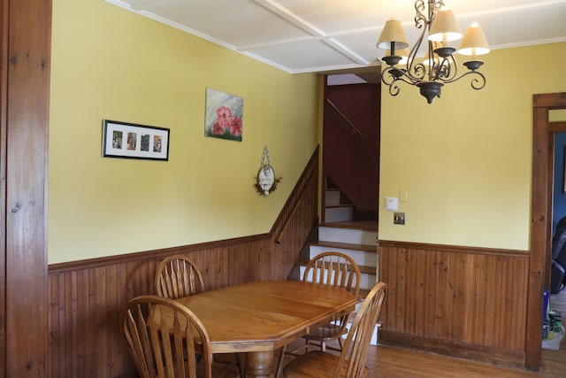 63 Province St, Richford, VT 05476 - dining room featuring wooden walls, wood finished floors, stairs, wainscoting, and a notable chandelier