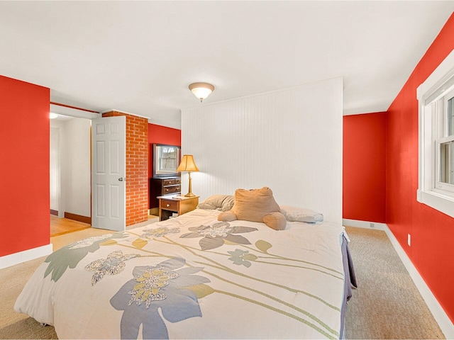 carpeted bedroom with baseboards