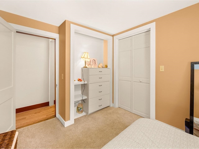 bedroom featuring baseboards and carpet floors