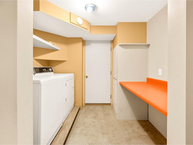 laundry area featuring independent washer and dryer and light carpet
