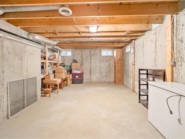 below grade area with washer / clothes dryer and visible vents