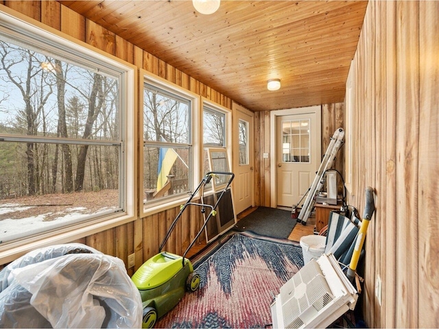 sunroom / solarium with wood ceiling and wood walls