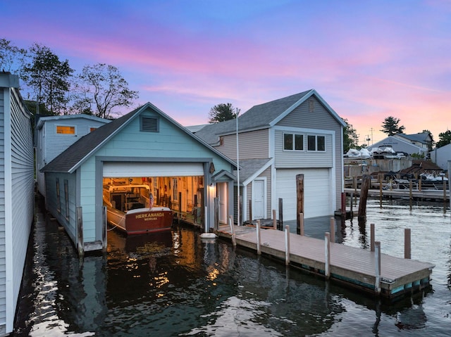 48 Channel Ln, Laconia, NH 03246 - rear view of property with a water view, a shingled roof, and a detached garage
