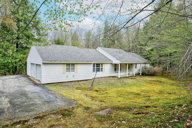321 Rolling Ridge Rd, Bartlett, NH 03812 - view of front of home with a porch, a garage, a front lawn, and a shingled roof