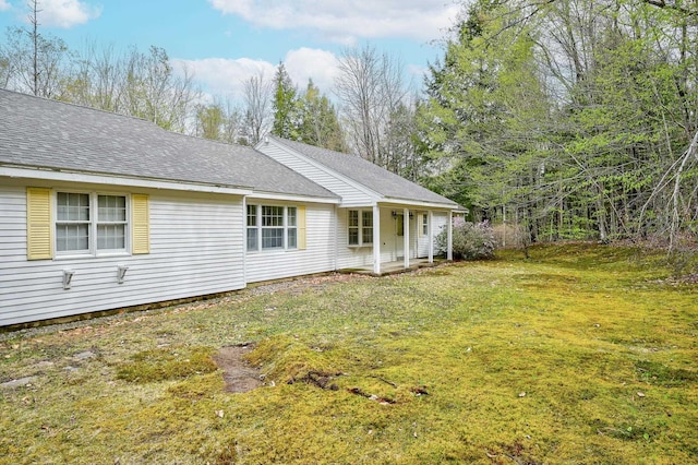 321 Rolling Ridge Rd, Bartlett, NH 03812 - back of property with a lawn, a porch, and roof with shingles