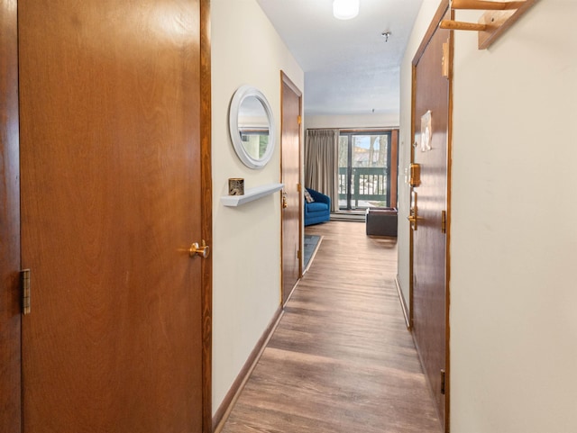 133 E Mountain Rd Unit 3C17, Killington, VT 05751 - hall featuring baseboards and wood finished floors
