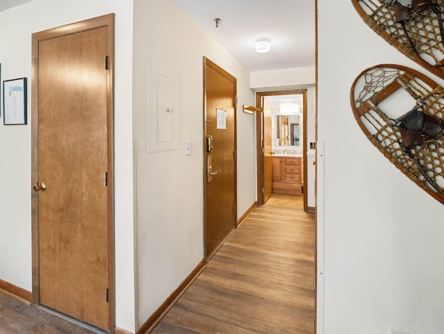 133 E Mountain Rd Unit 3C17, Killington, VT 05751 - hall featuring baseboards, light wood-style floors, and electric panel