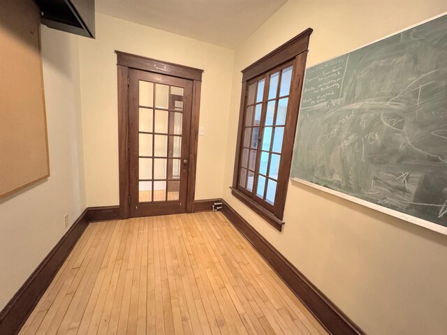 42 Elm St, Claremont, NH 03743 - hallway with wood-type flooring and baseboards