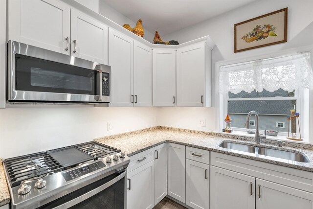7 John Hardie Way, Chichester, NH 03234 - kitchen with white cabinets, a sink, light stone countertops, and appliances with stainless steel finishes