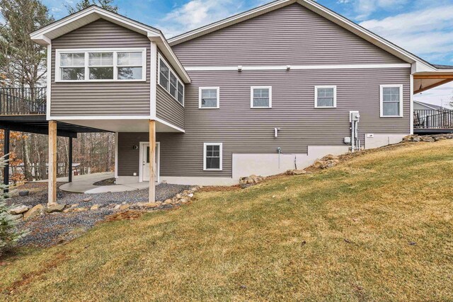 7 John Hardie Way, Chichester, NH 03234 - rear view of property featuring a patio and a lawn